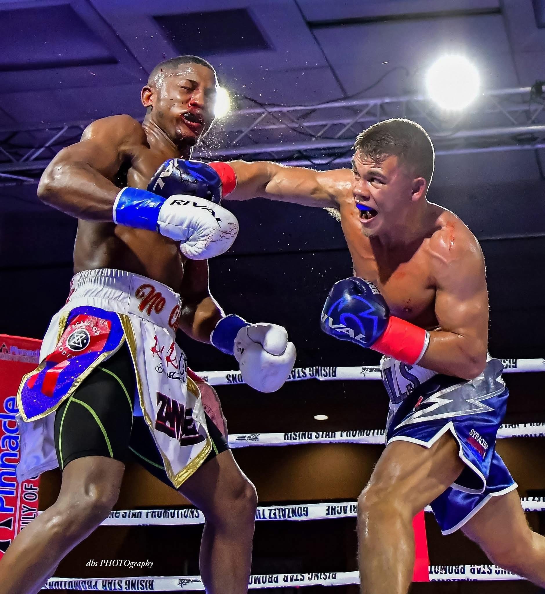 Bryce Mills landing a punch in a boxing match